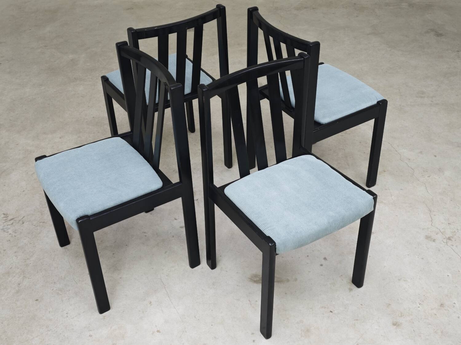 Set of 4 modernist black chairs with light blue ribbed fabric
