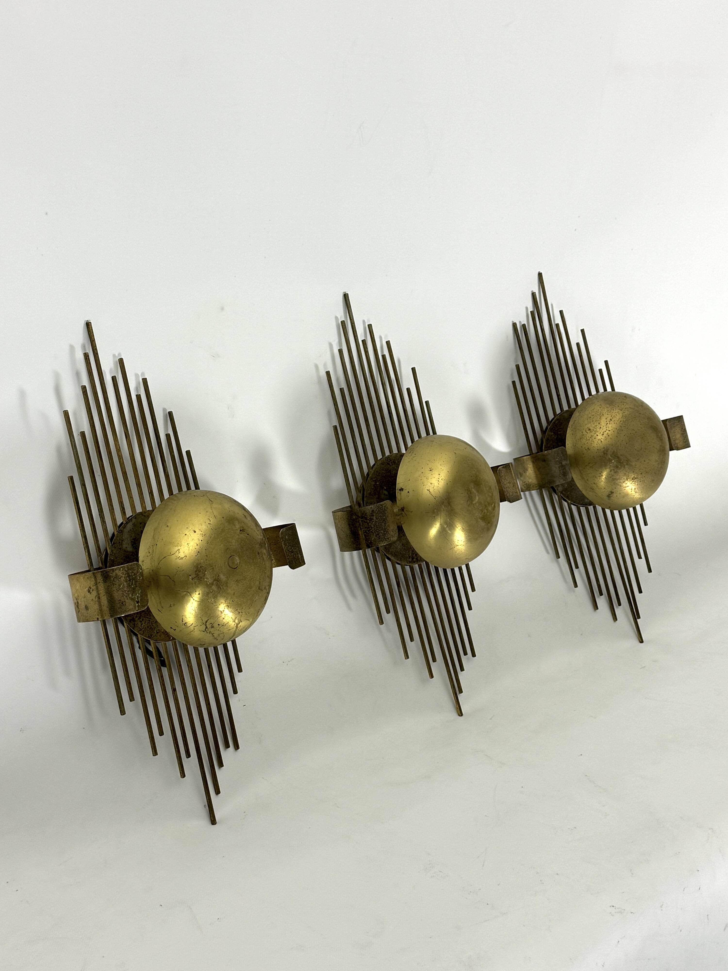 Mid-Century Set of three gilded metal sconces. Italy 1950s