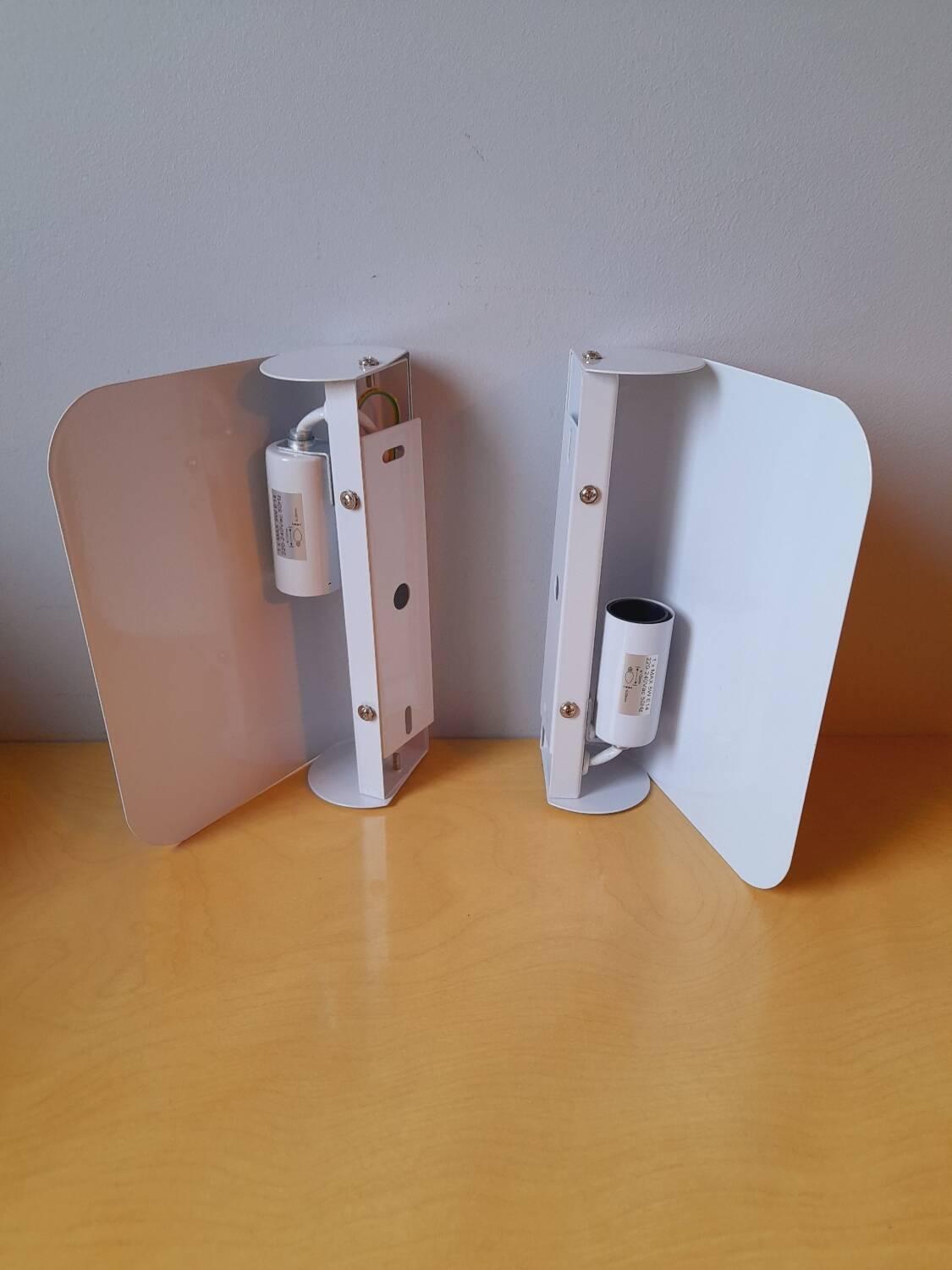 White lacquered metal wall sconces