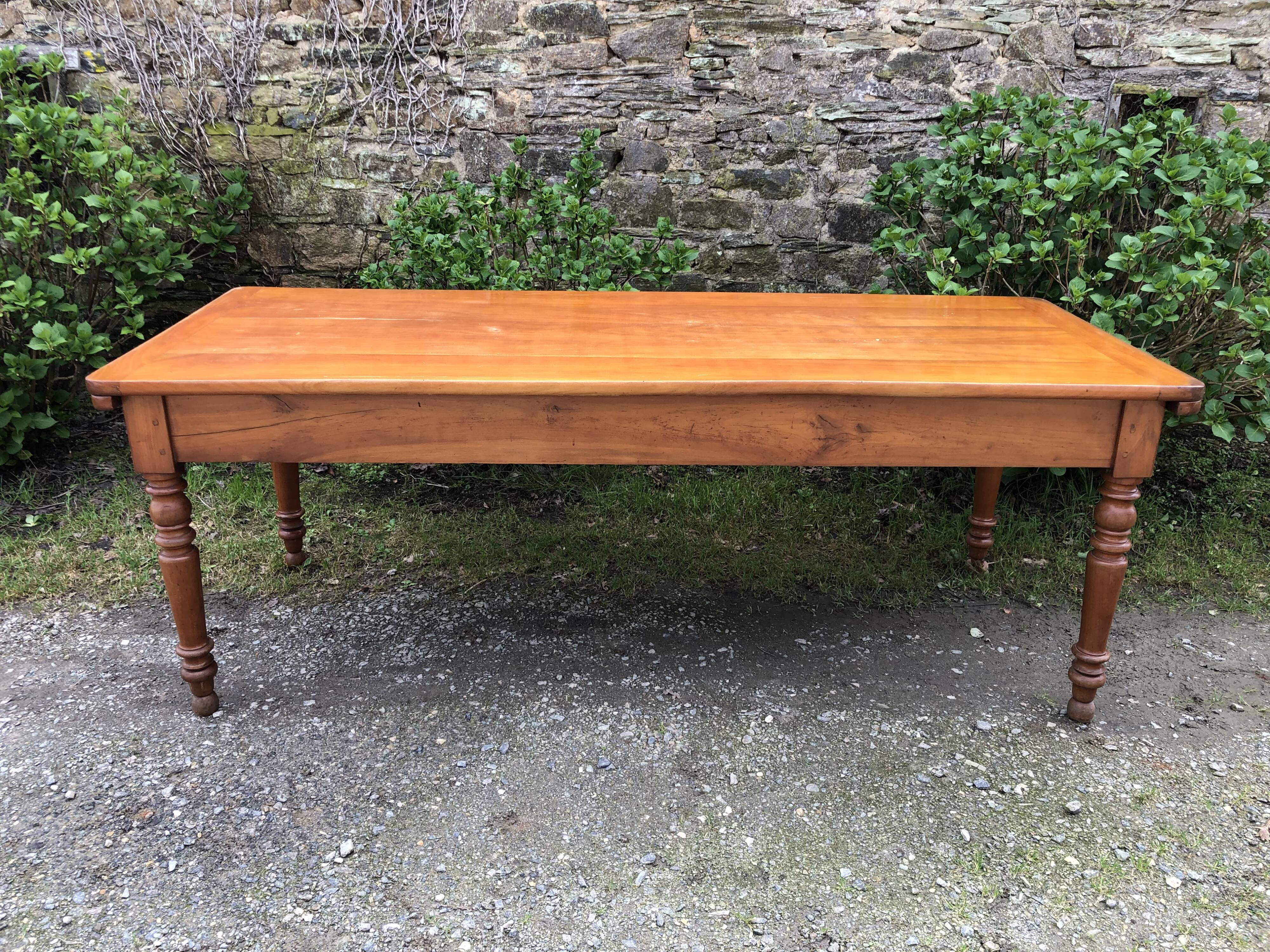Antique Louis Philippe style farmhouse table in solid cherry wood with its 2 extensions.