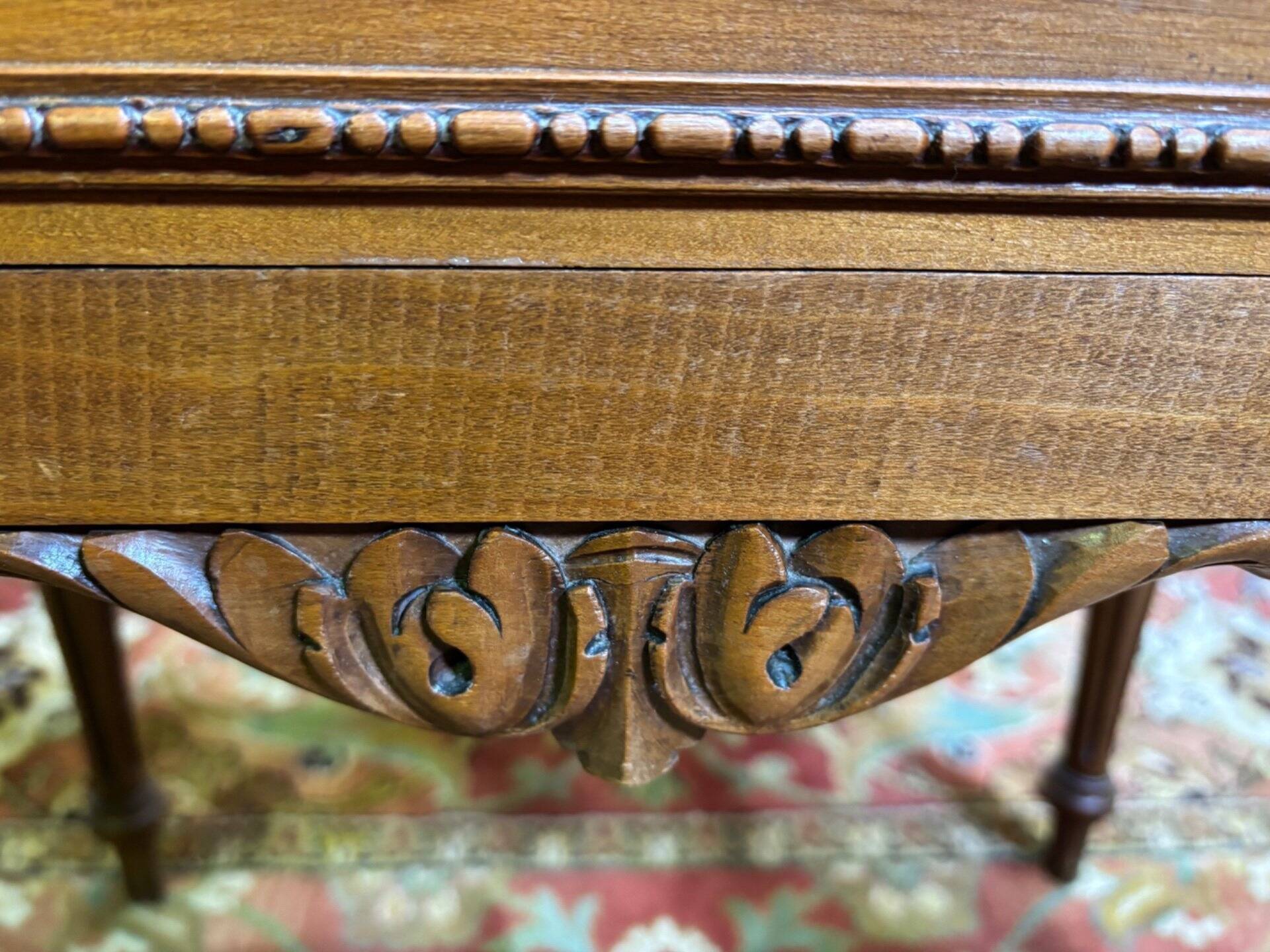 Louis XVI style molded and carved walnut chest of drawers