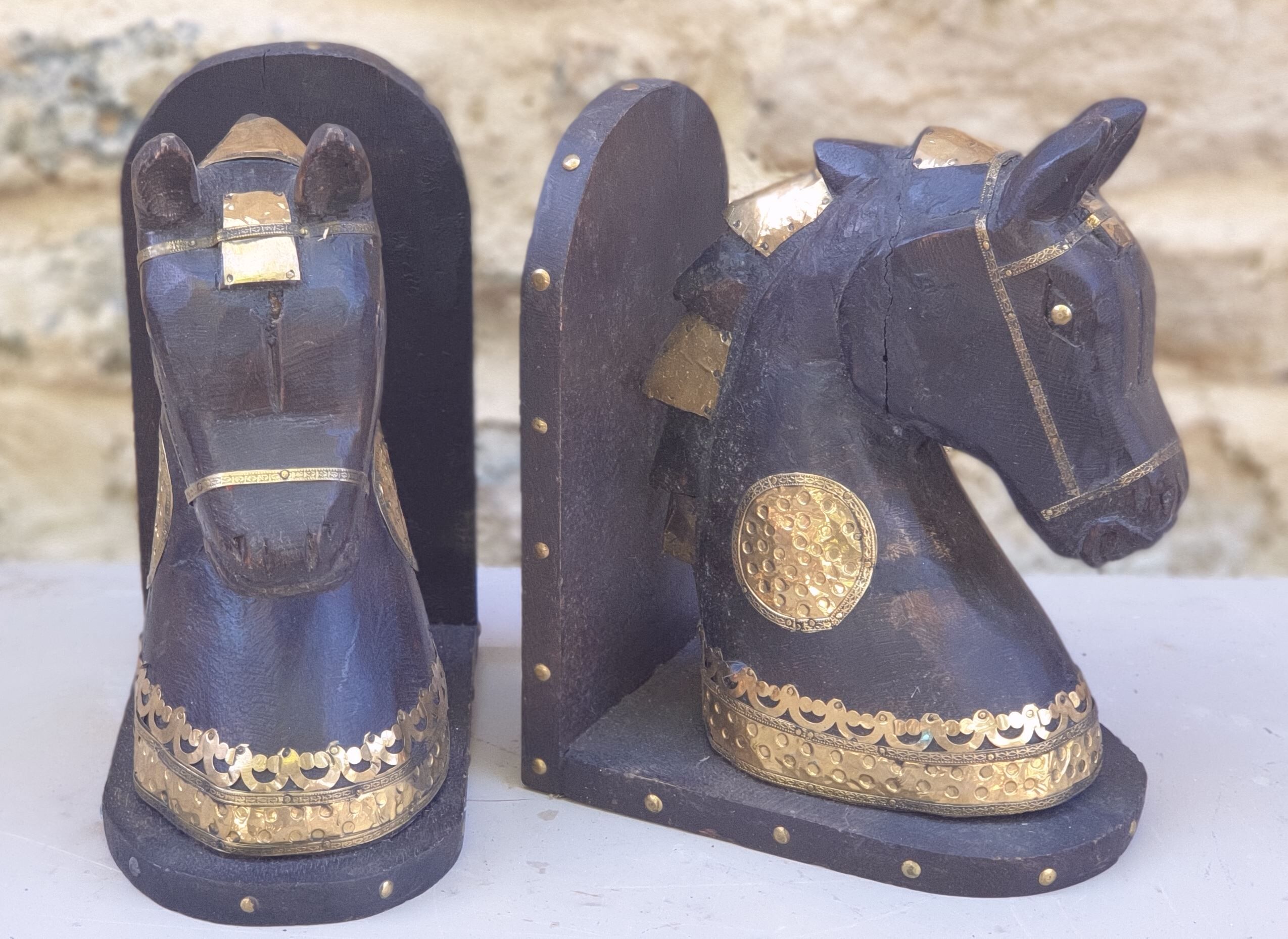 Horse bookbands in carved wood and brass