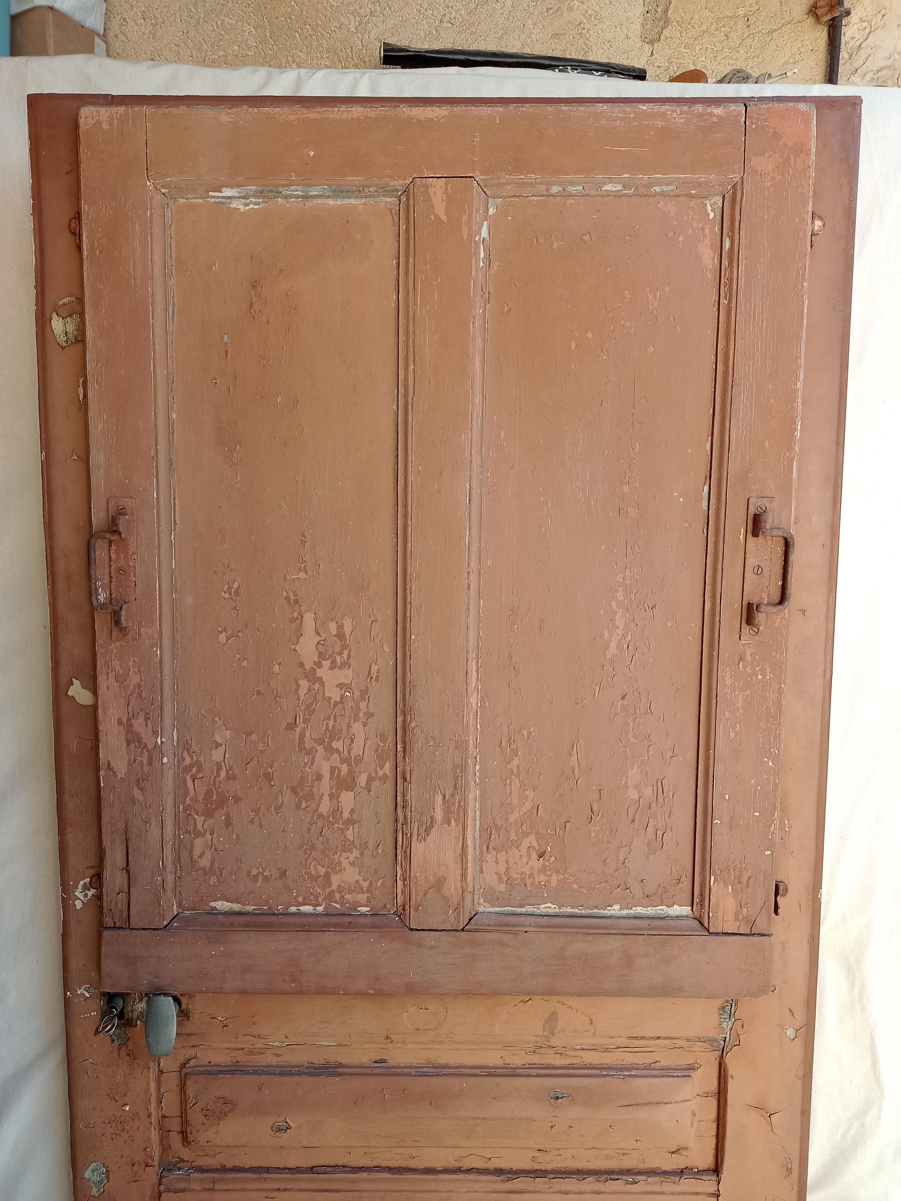 Old glazed door with its shutter