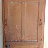 Old glazed door with its shutter