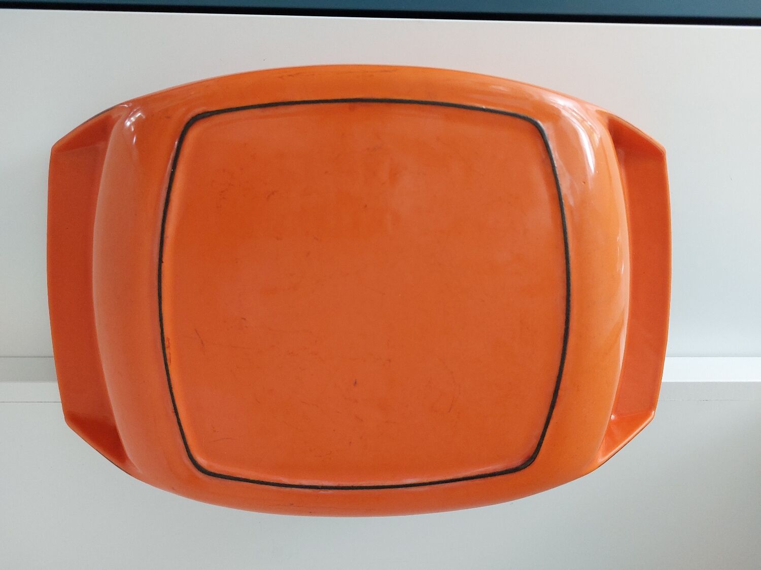 Double casserole in orange cast iron Le Creuset design Raymond Loewy