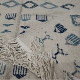 Handmade white and blue rug made of natural wool
