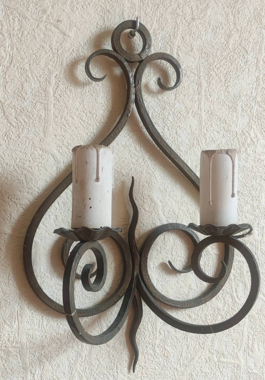 Old pair of wrought iron wall lights