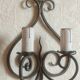 Old pair of wrought iron wall lights