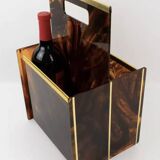 Tortoiseshell lucite magazine rack from the Christian Dior Home collection.