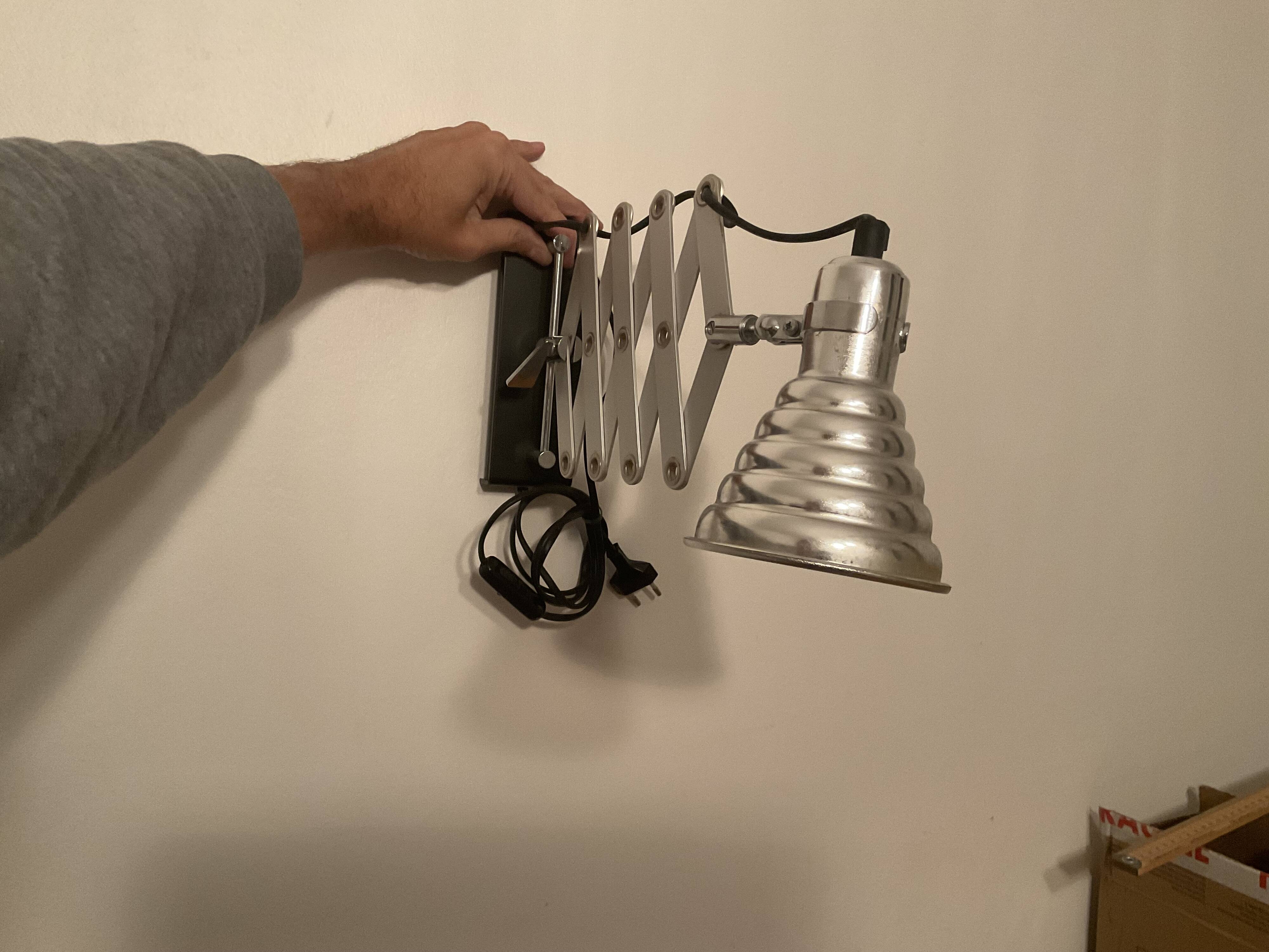 Industrial accordion wall light