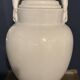 Large white faience jug with a satyr head spout, 19th century.