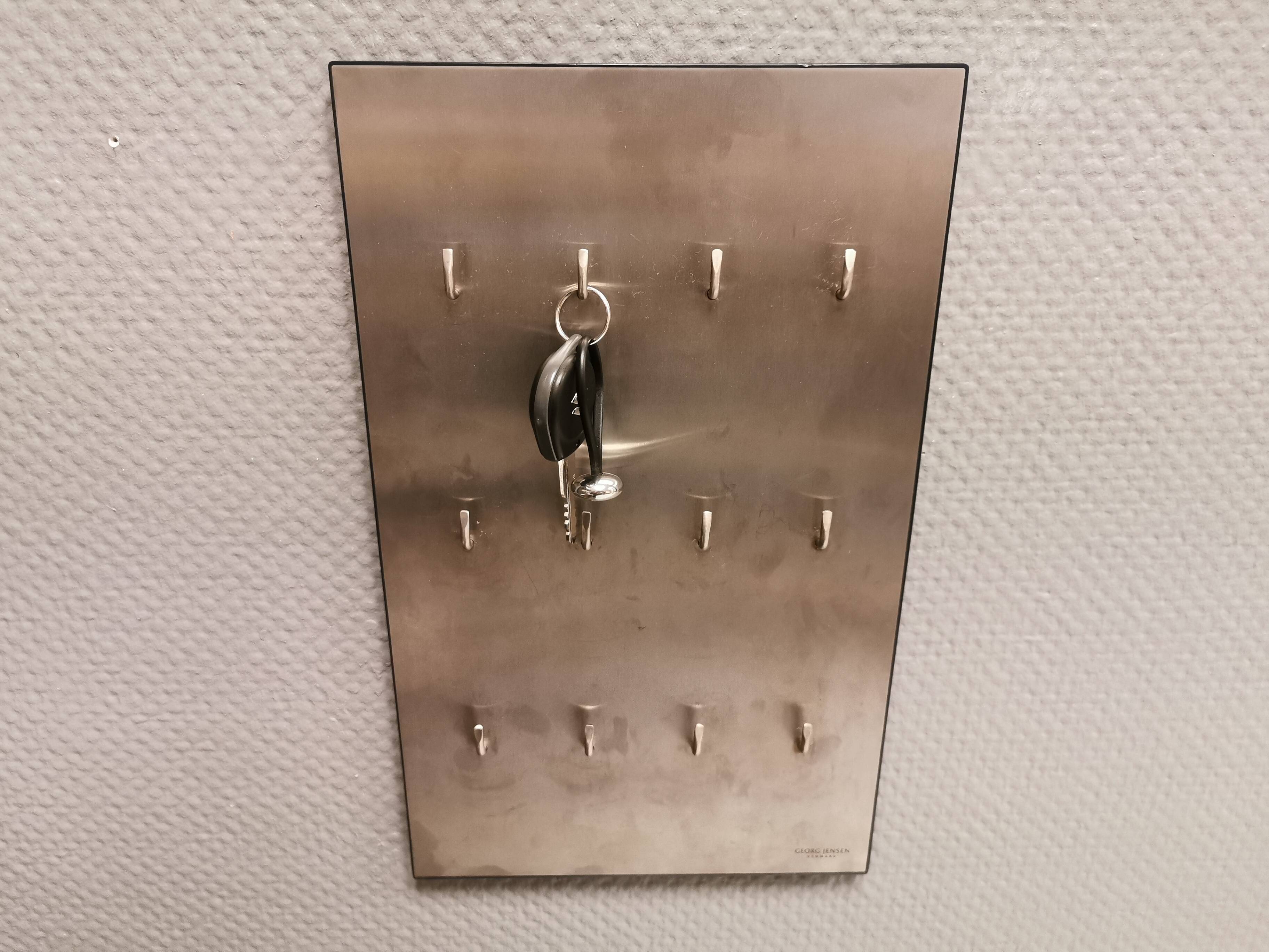 George Jensen key hanging board in brushed steel in classic Danish design.