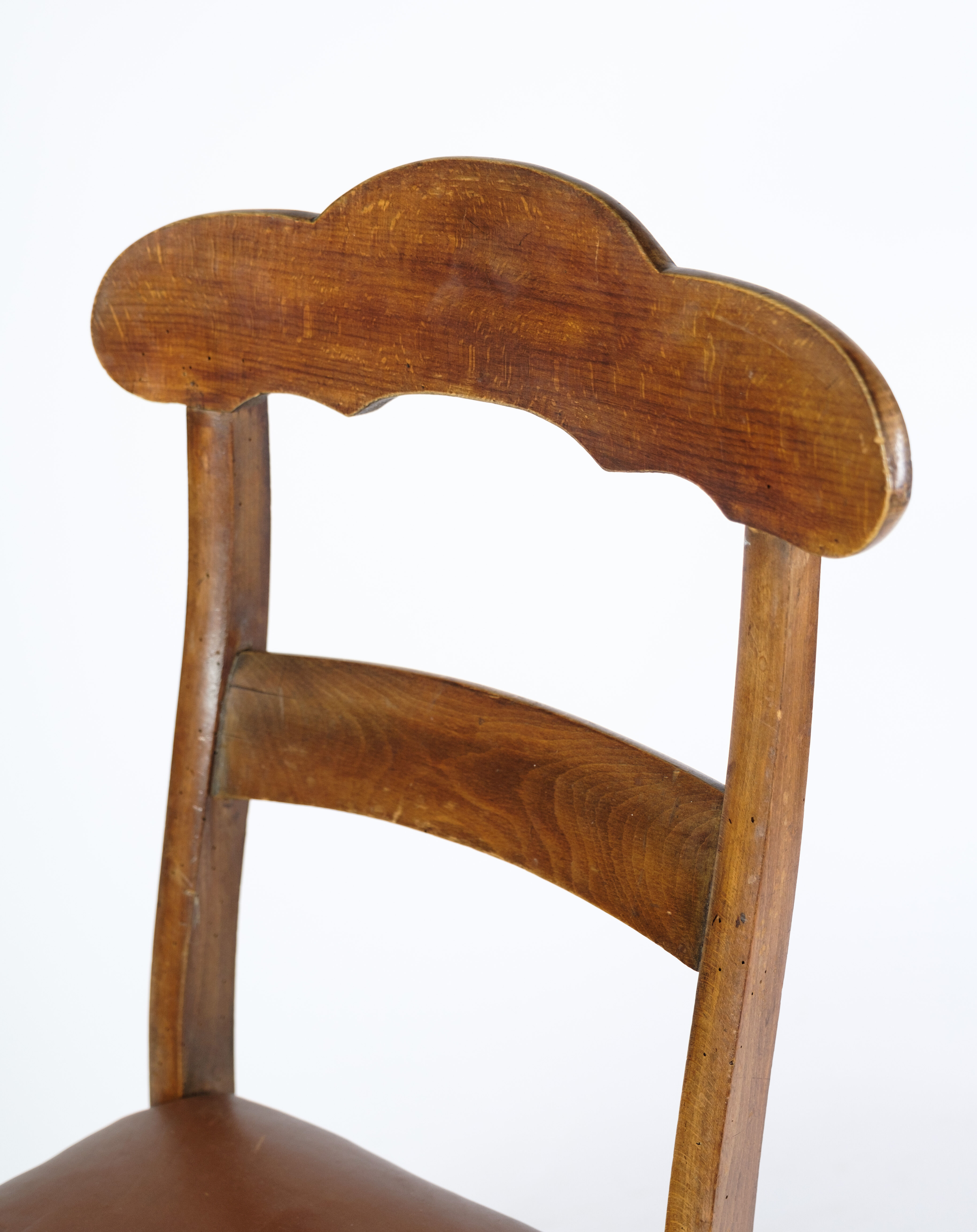 Set of eight late empire chairs in high quality brown leather in mahogany