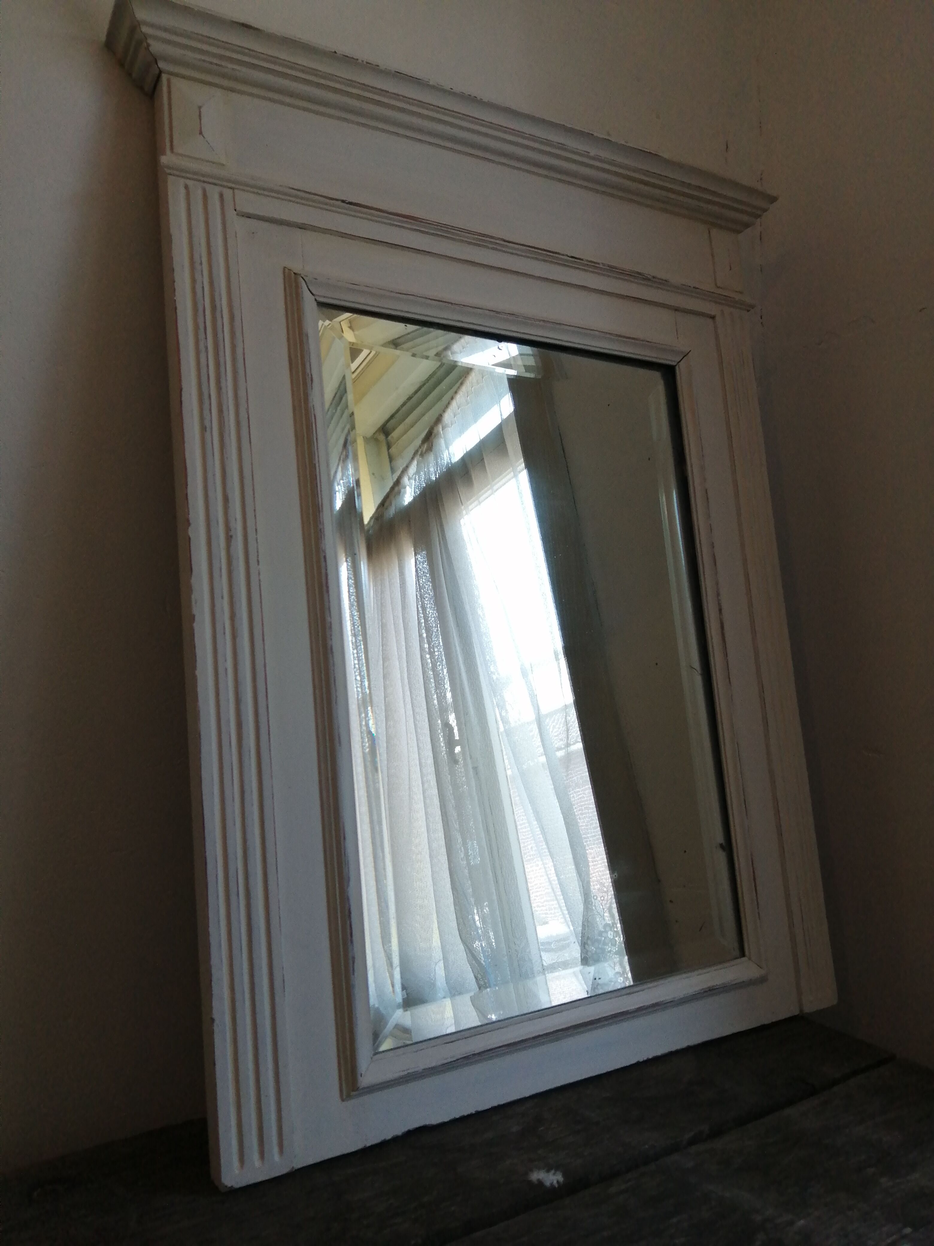 Beveled fireplace mirror