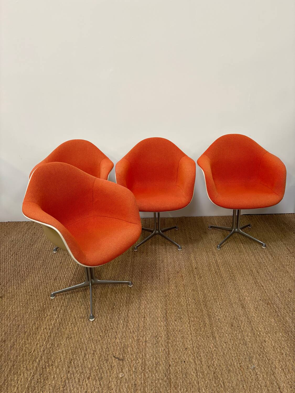 Set of 6 Eams armchairs in Hermann Miller orange fiber shell
