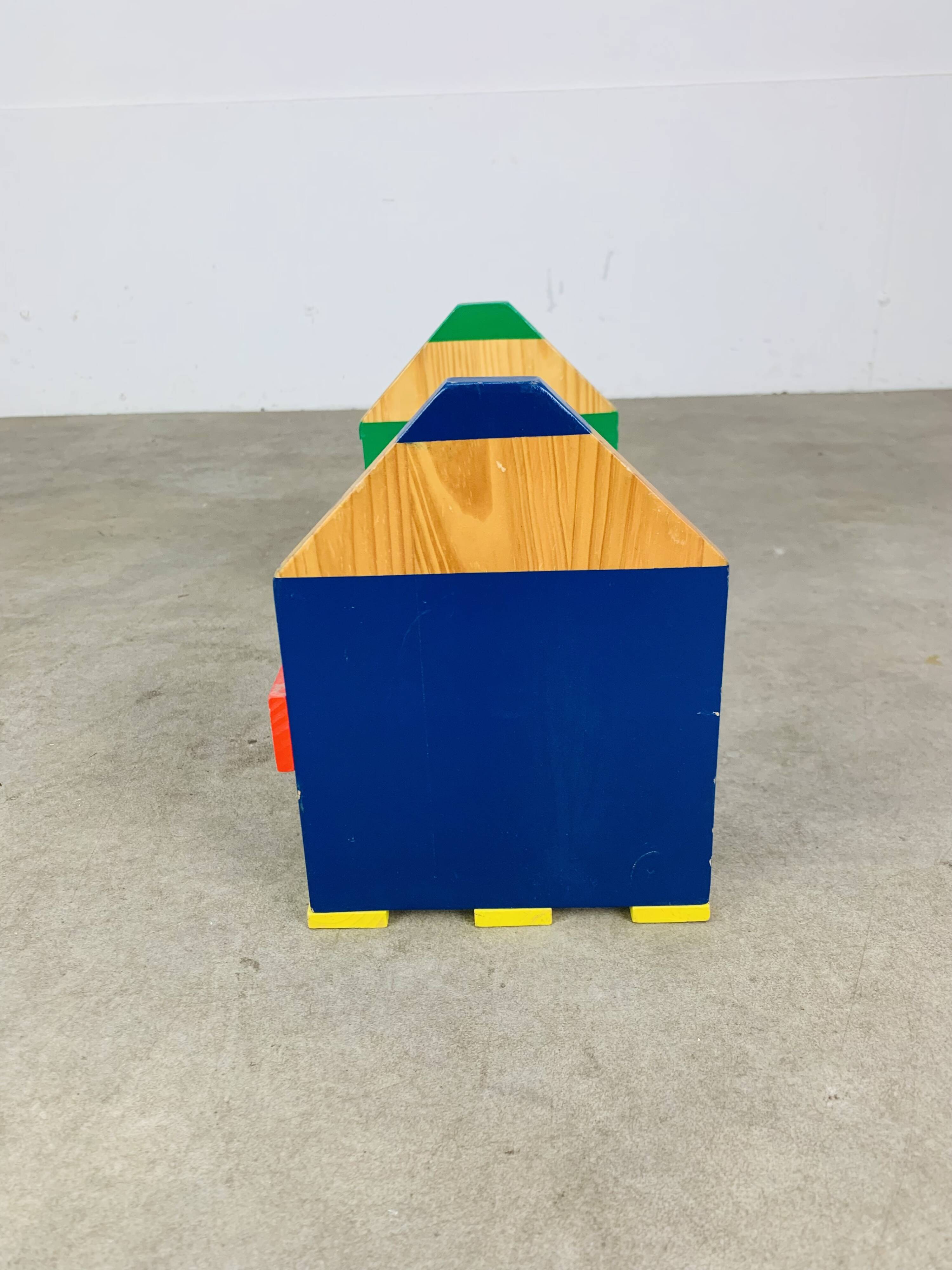 Wall-mounted pencil shelf for children, Pierre Sala style.