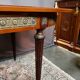 Louis XVI style oval dining table with rosewood marquetry extension mounted in bronze
