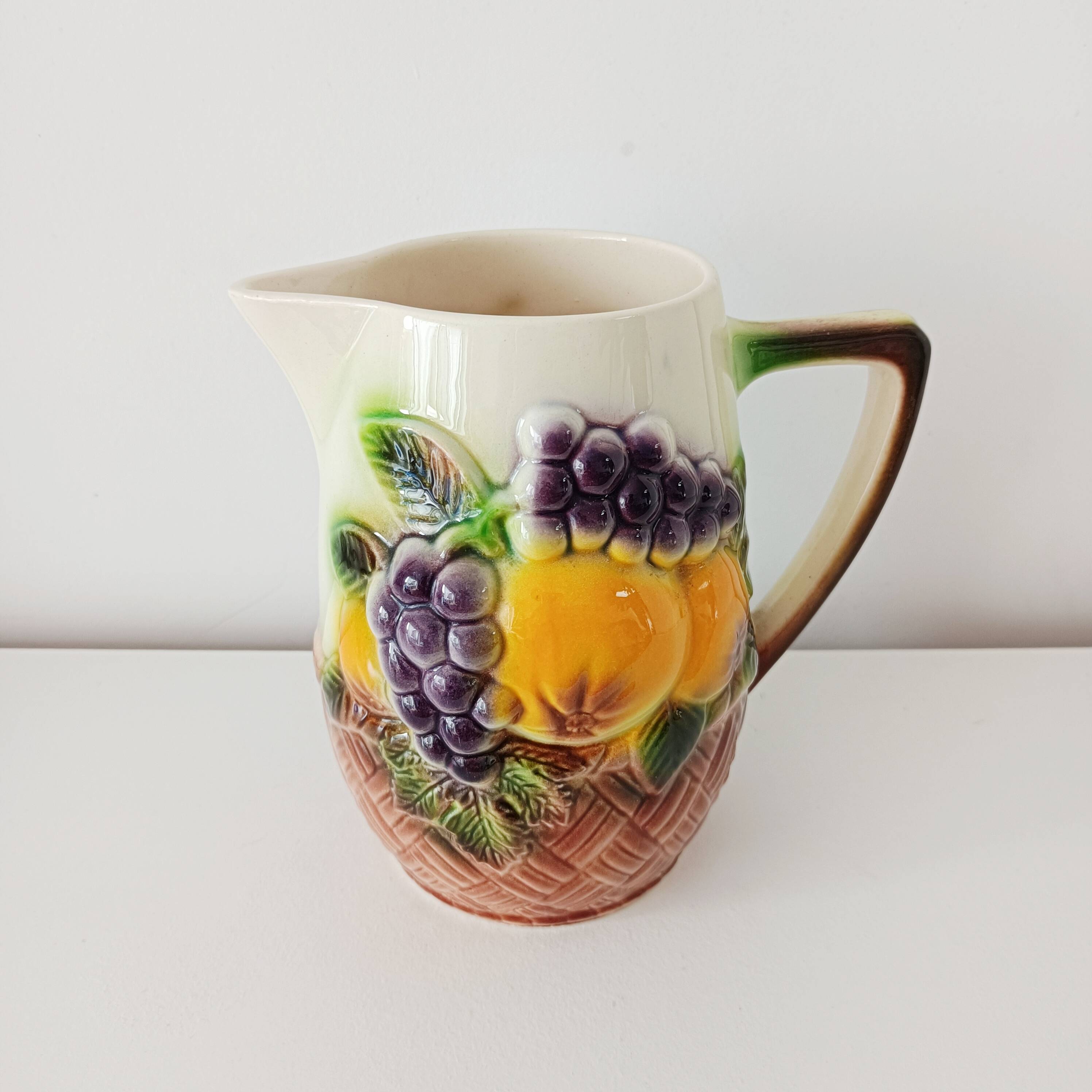 St-Clément pitcher in slip, fruit decoration