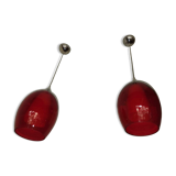 Pair of conical pendant lights in red tinted glass
