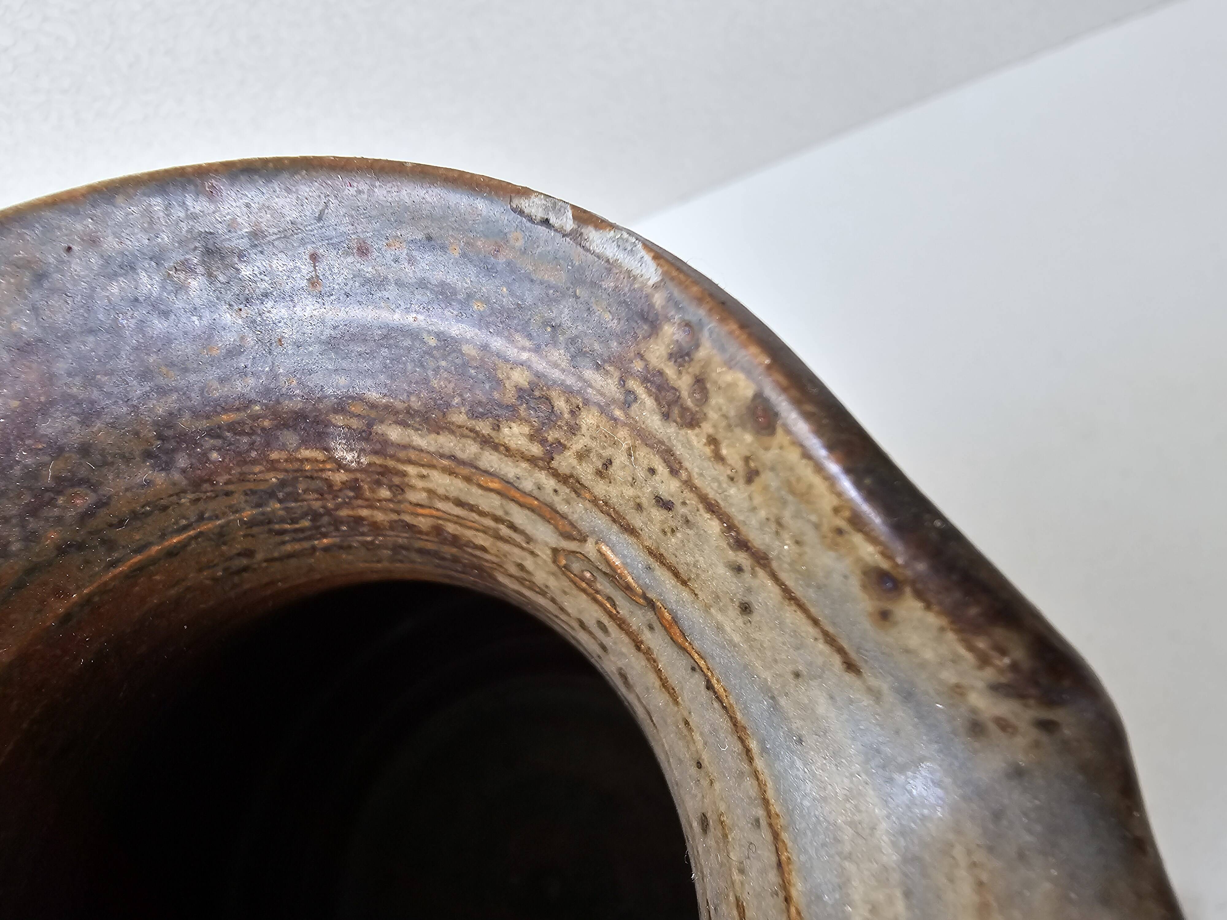 Pyrithed stoneware ceramic pitcher signed GRh. (signature to be identified)