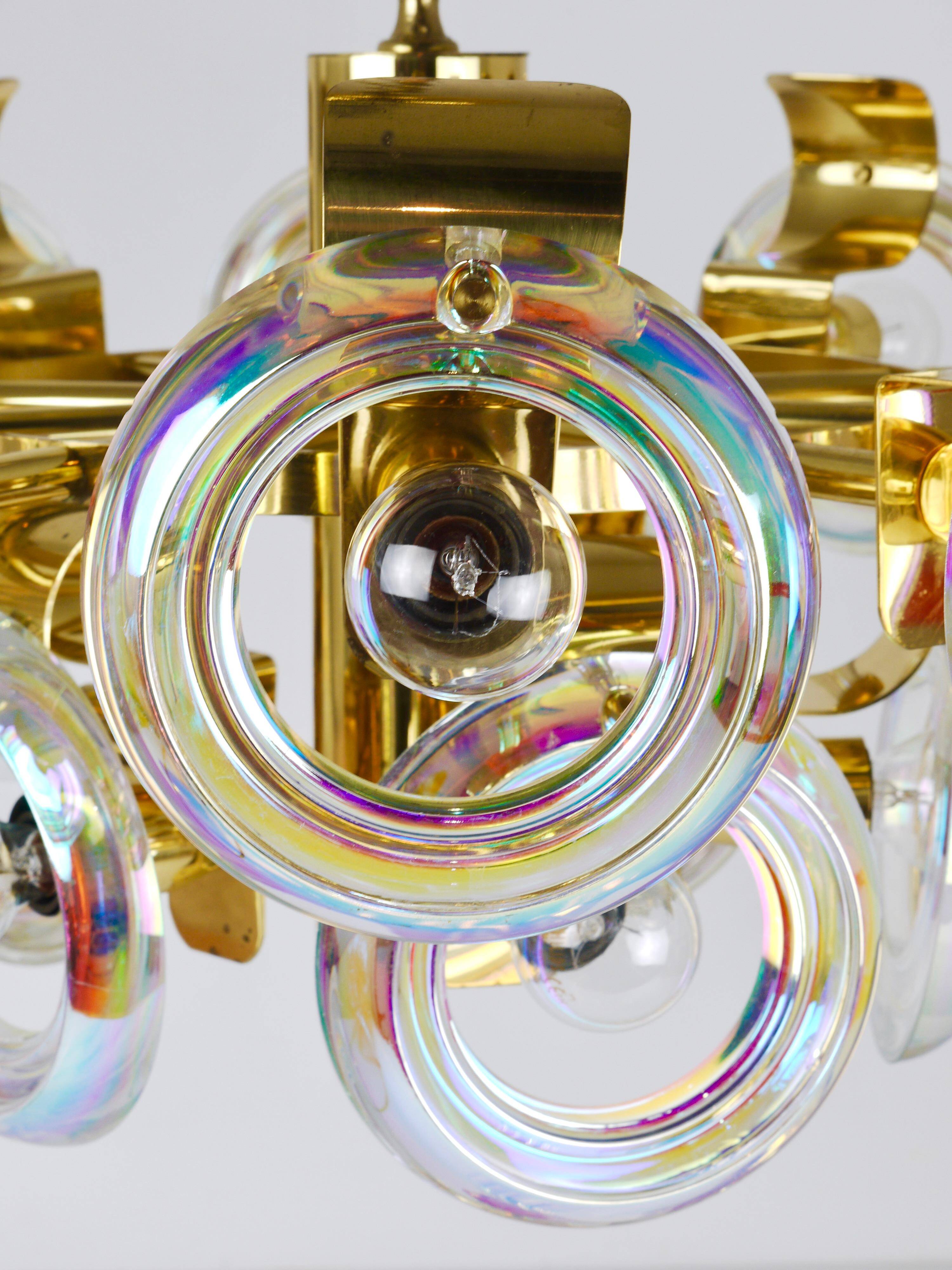 Large brass chandelier by Oscar Torlasco, rainbow optical glass rings, Italy, 1970s.
