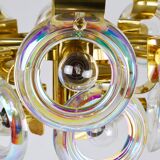Large brass chandelier by Oscar Torlasco, rainbow optical glass rings, Italy, 1970s.