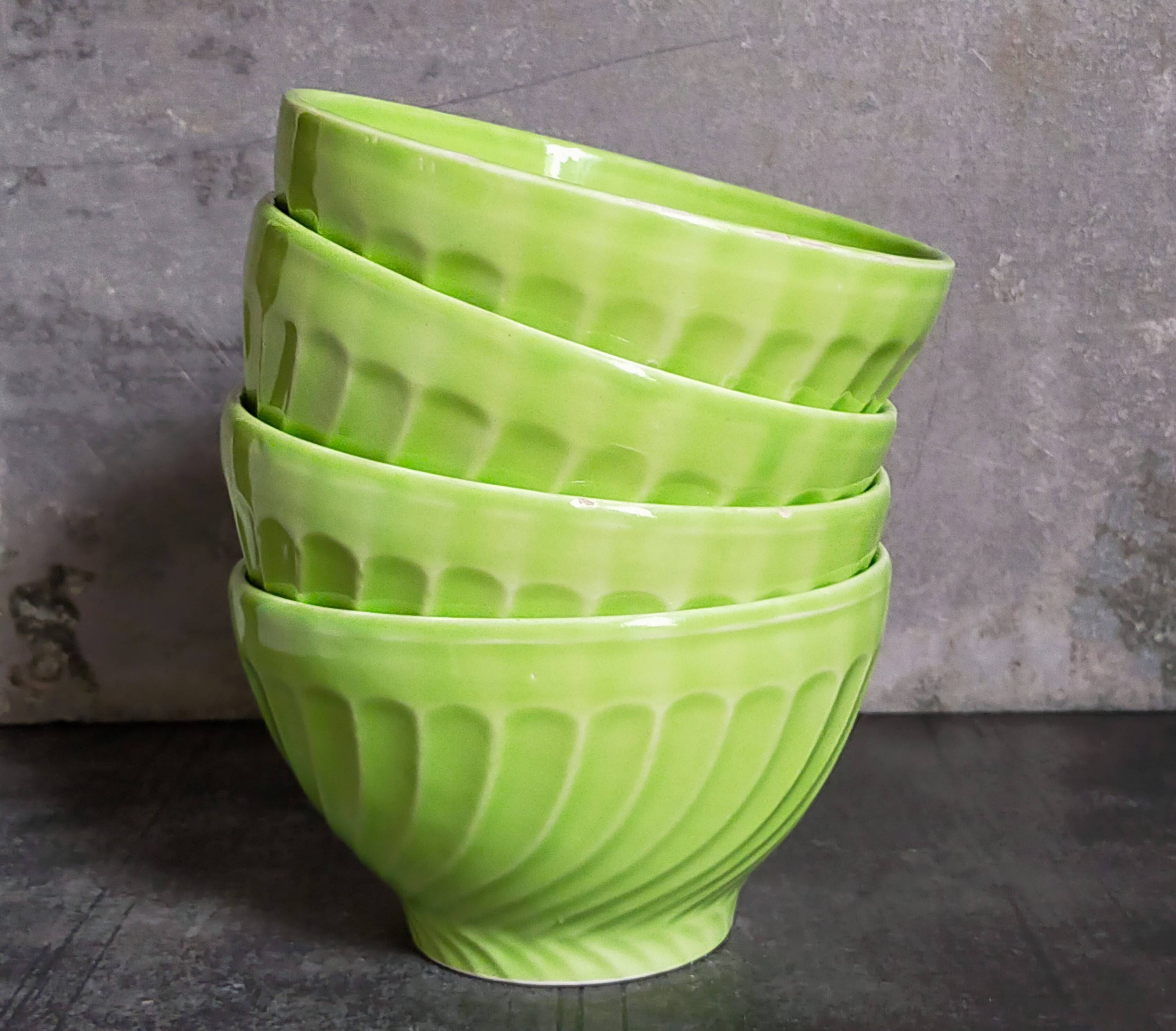 Four vintage spring green earthenware bowls