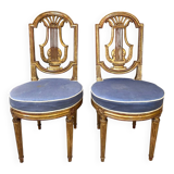 Paire de chaises style Louis XVI en bois doré