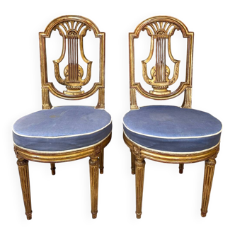 Paire de chaises style Louis XVI en bois doré