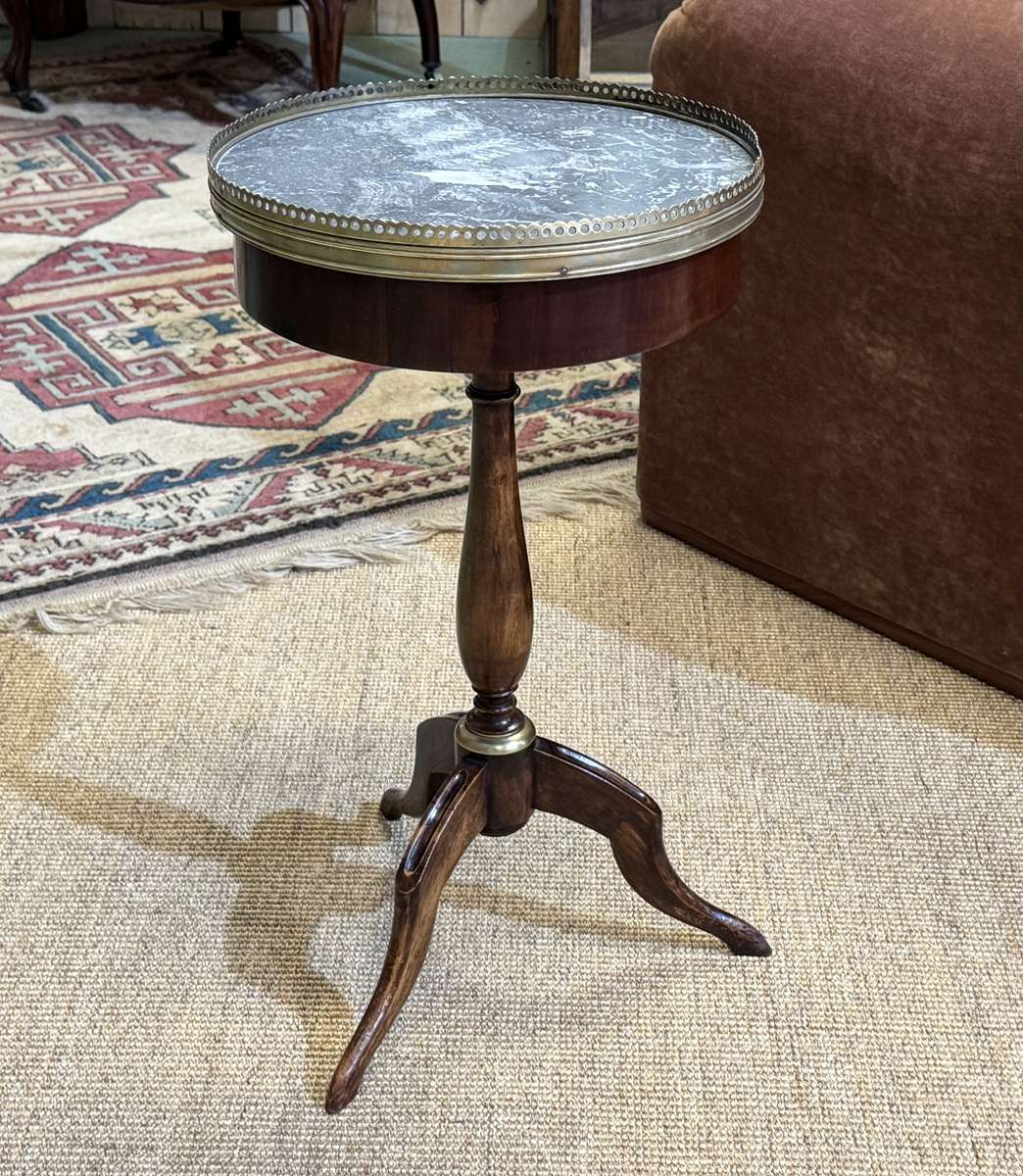 Mahogany gueridon with marble top from the 1950s.