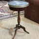 Mahogany gueridon with marble top from the 1950s.