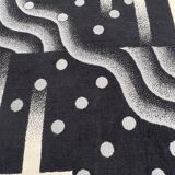 Tapis désigne
