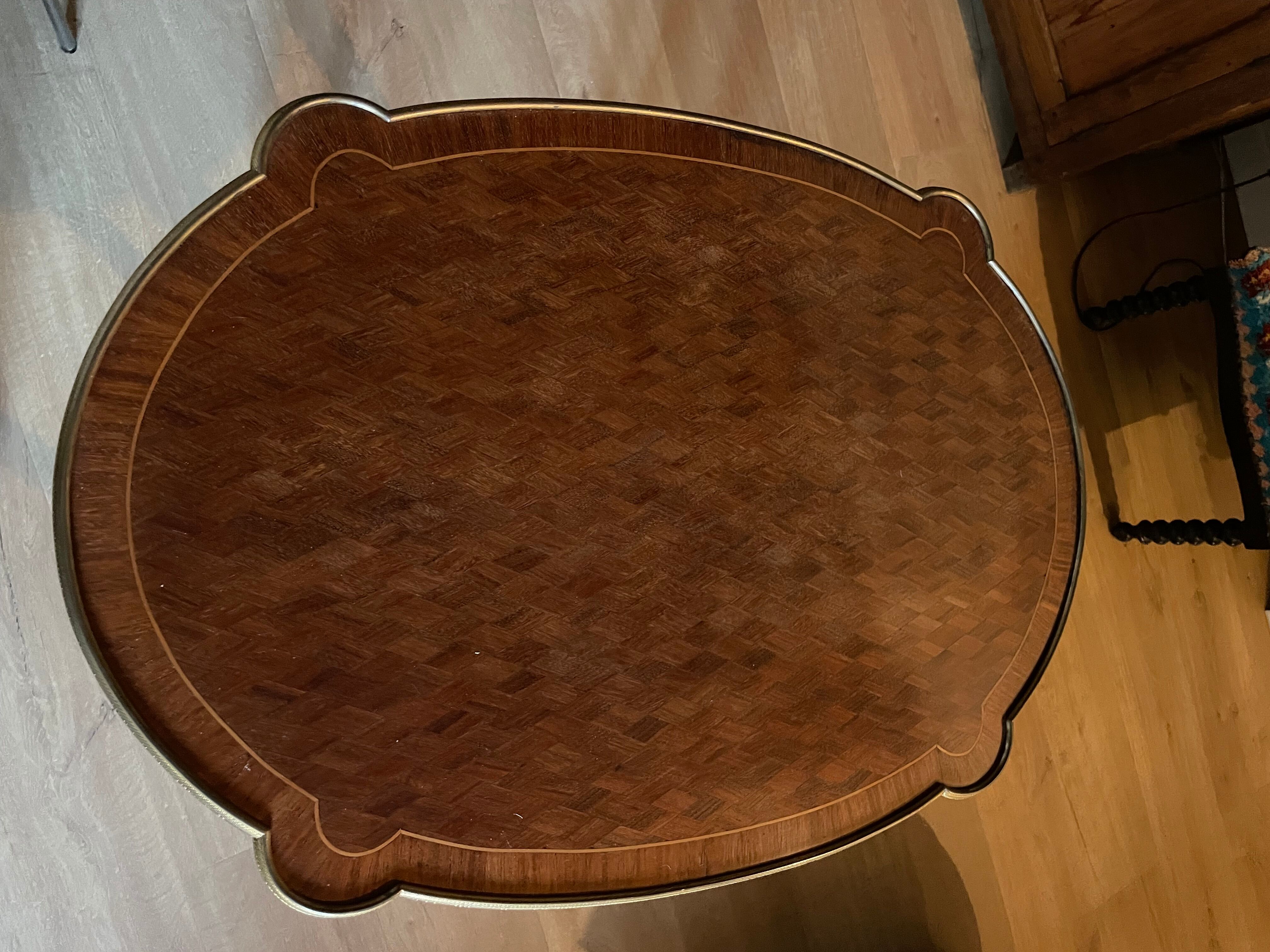 Living room table in Louis XV-Louis XVI transitional style with marquetry and bronze.