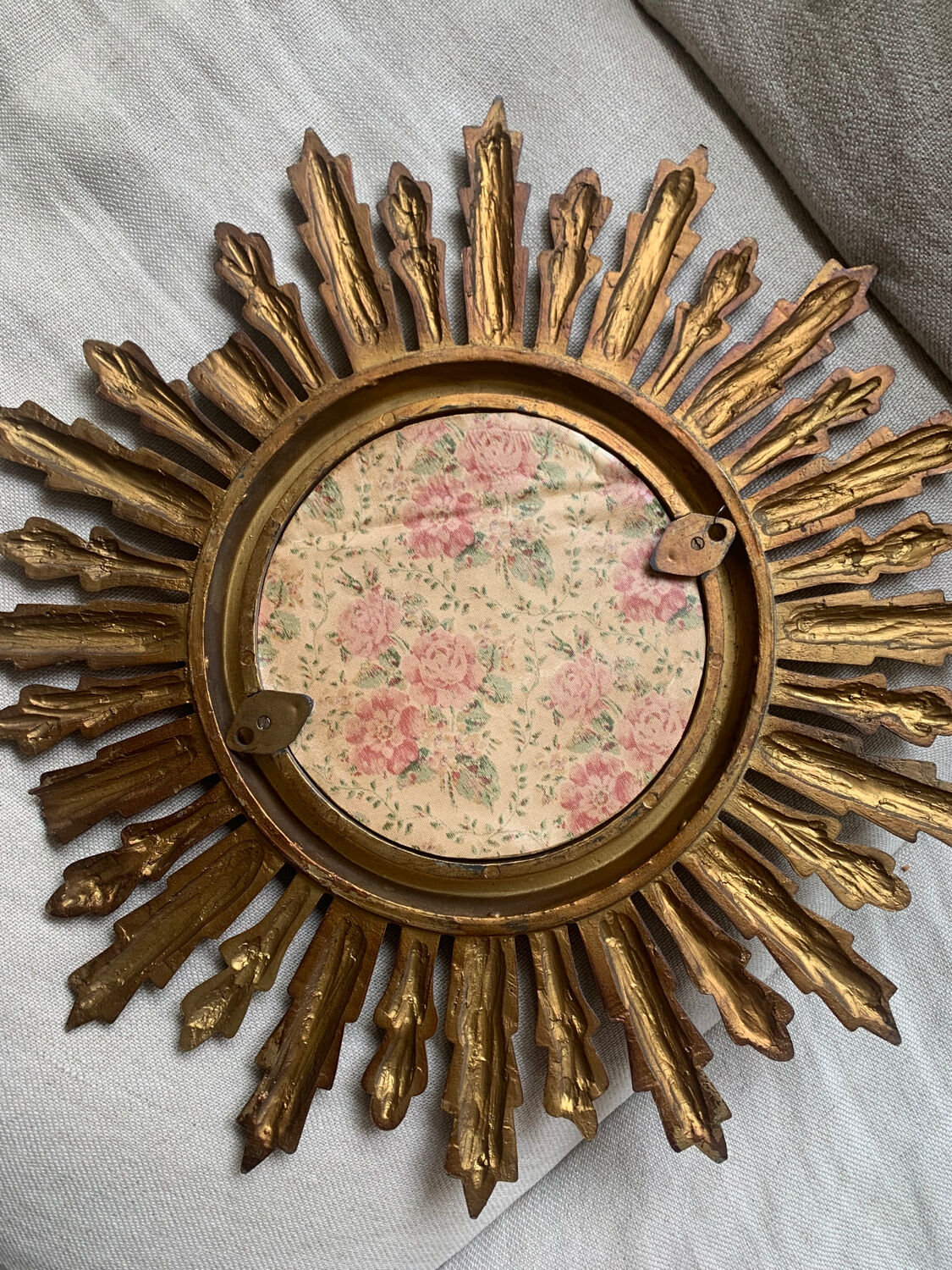 Sun mirror in old wood