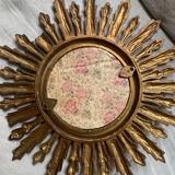 Sun mirror in old wood
