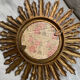 Sun mirror in old wood