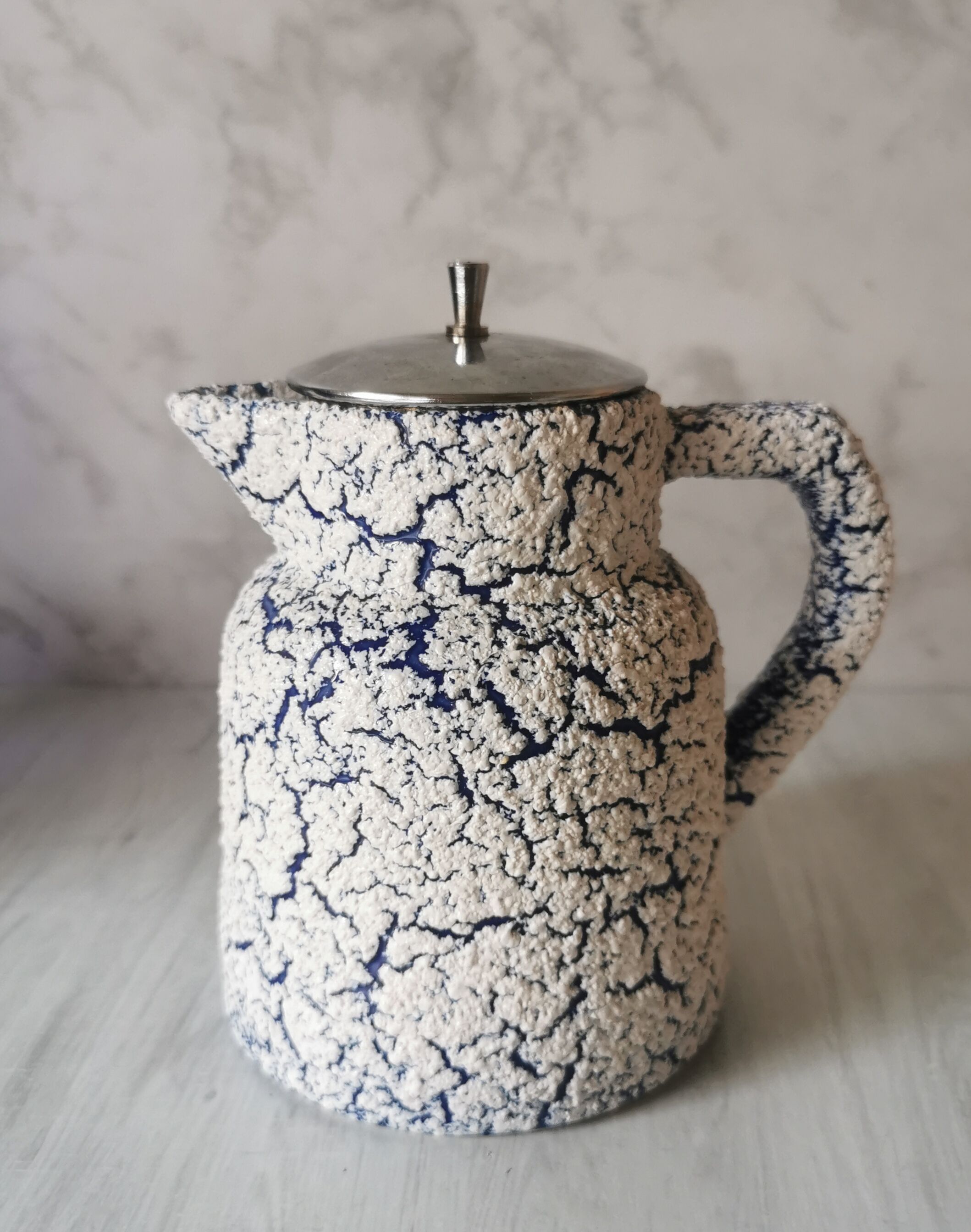 Cracked and enamelled ceramic teapot
