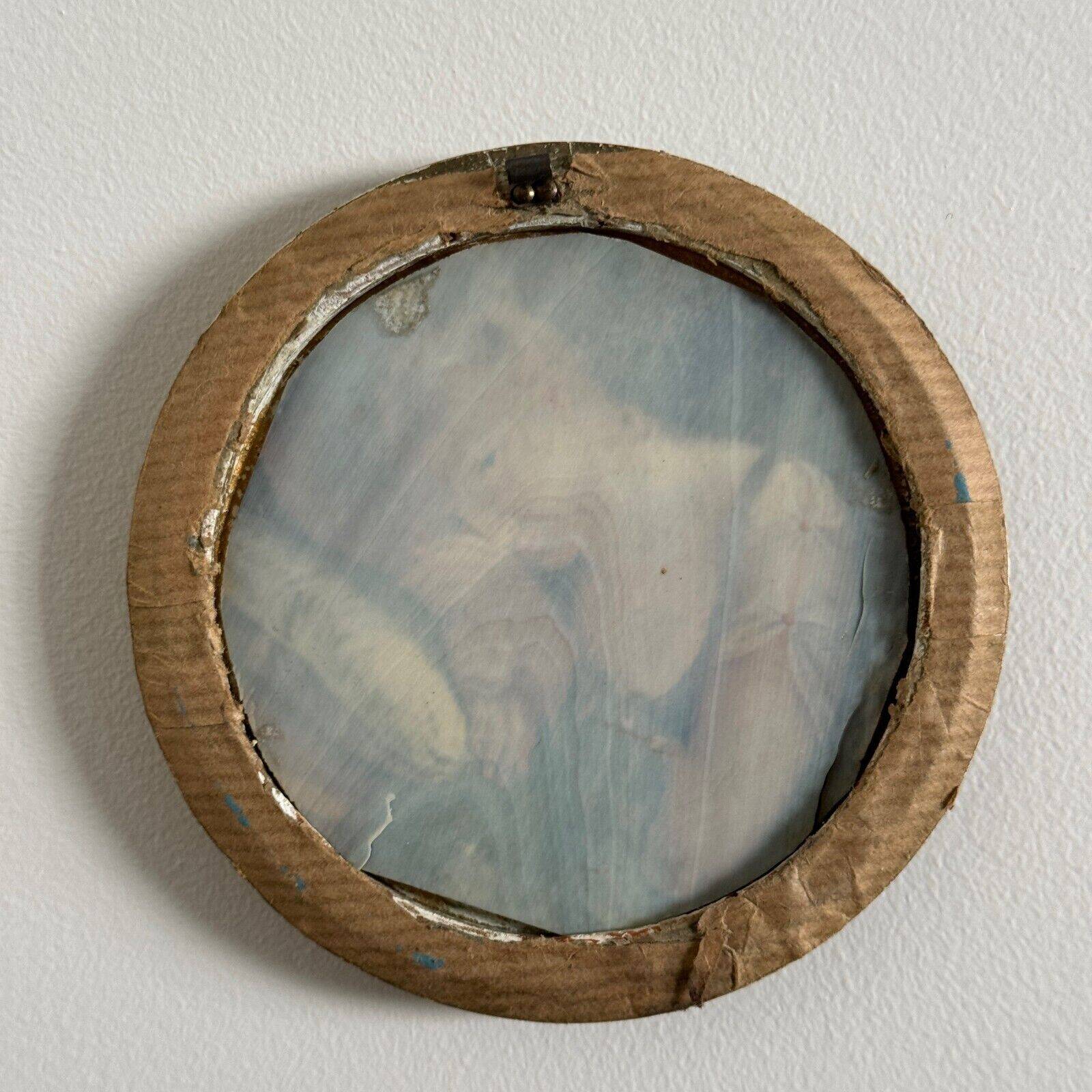 19th century miniature of a young girl with her head resting on a cushion