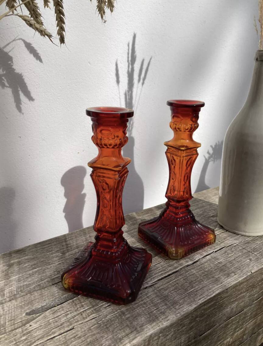 Pair of amber glass candlesticks