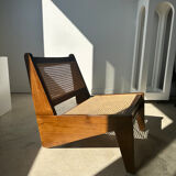 Reclined armchair in canned teak in natural wood