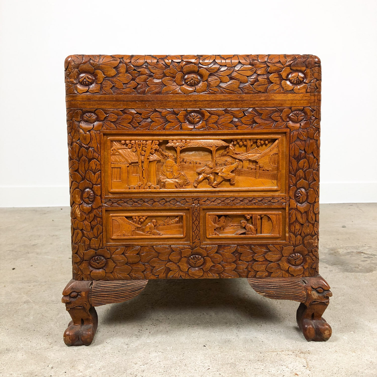 Vintage Chinese carved camphor wood chest on claw feet