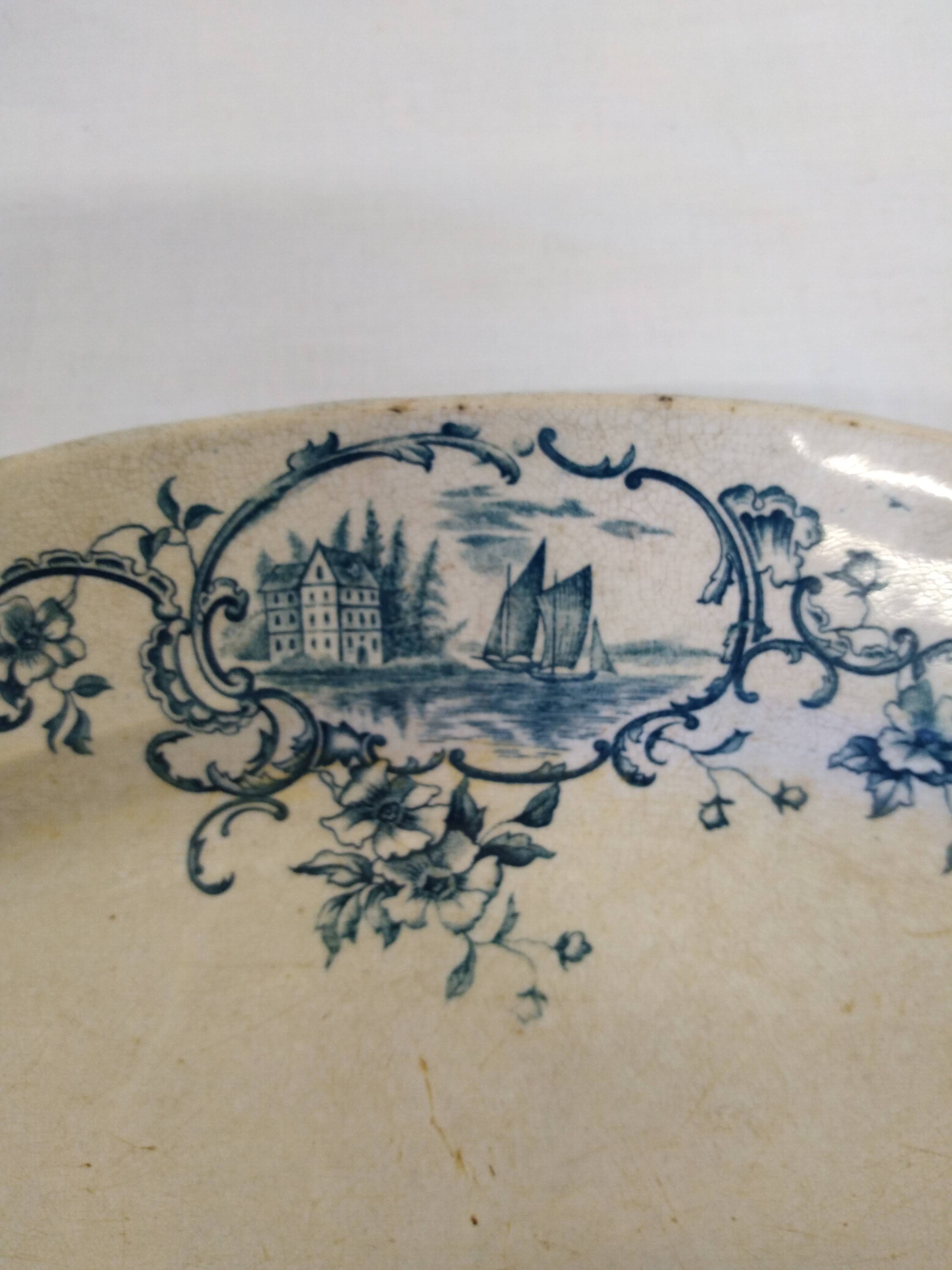 Old serving dish floral and maritime decoration