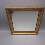 Small old mirror in wood and gilded stucco