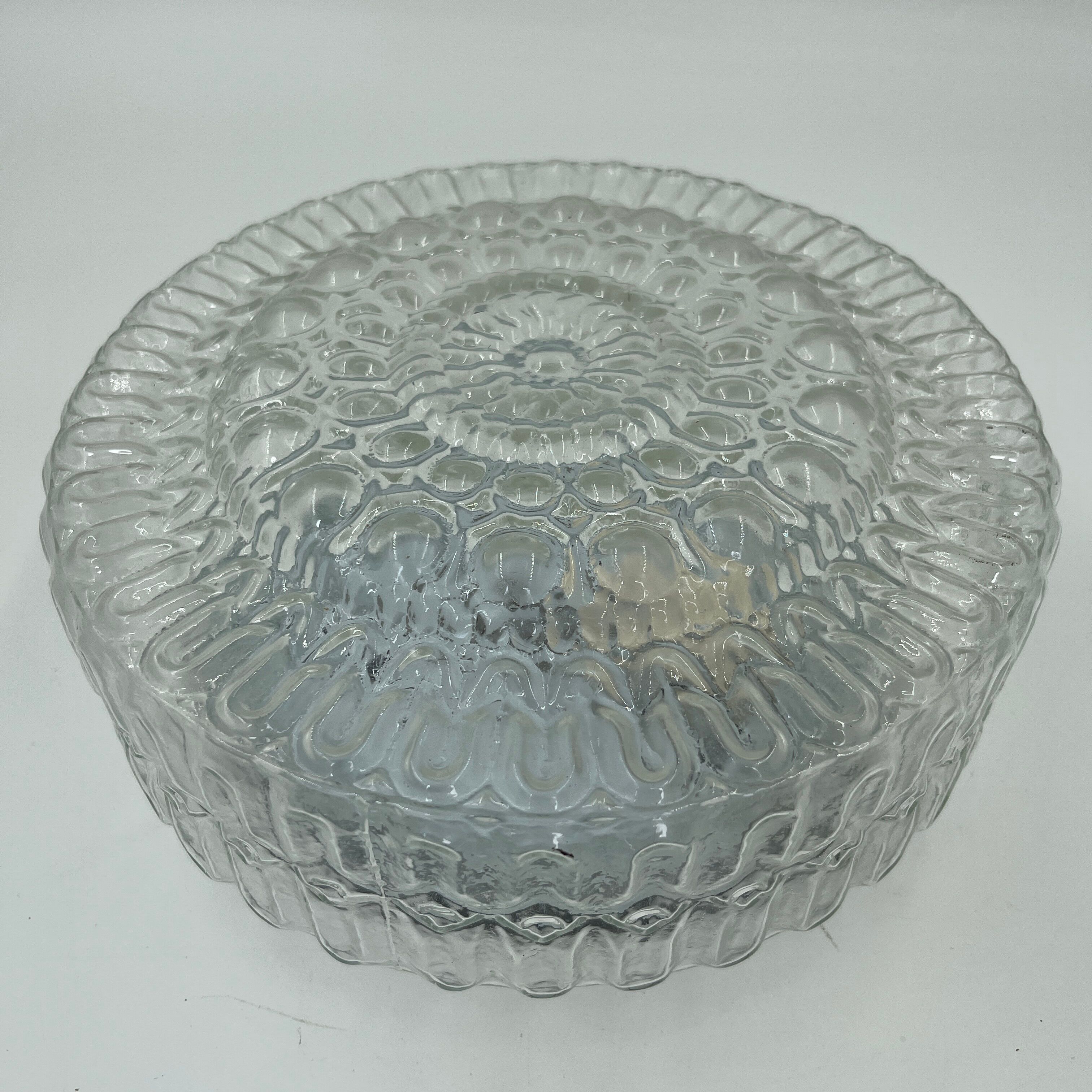 Cast glass ceiling lamp with relief