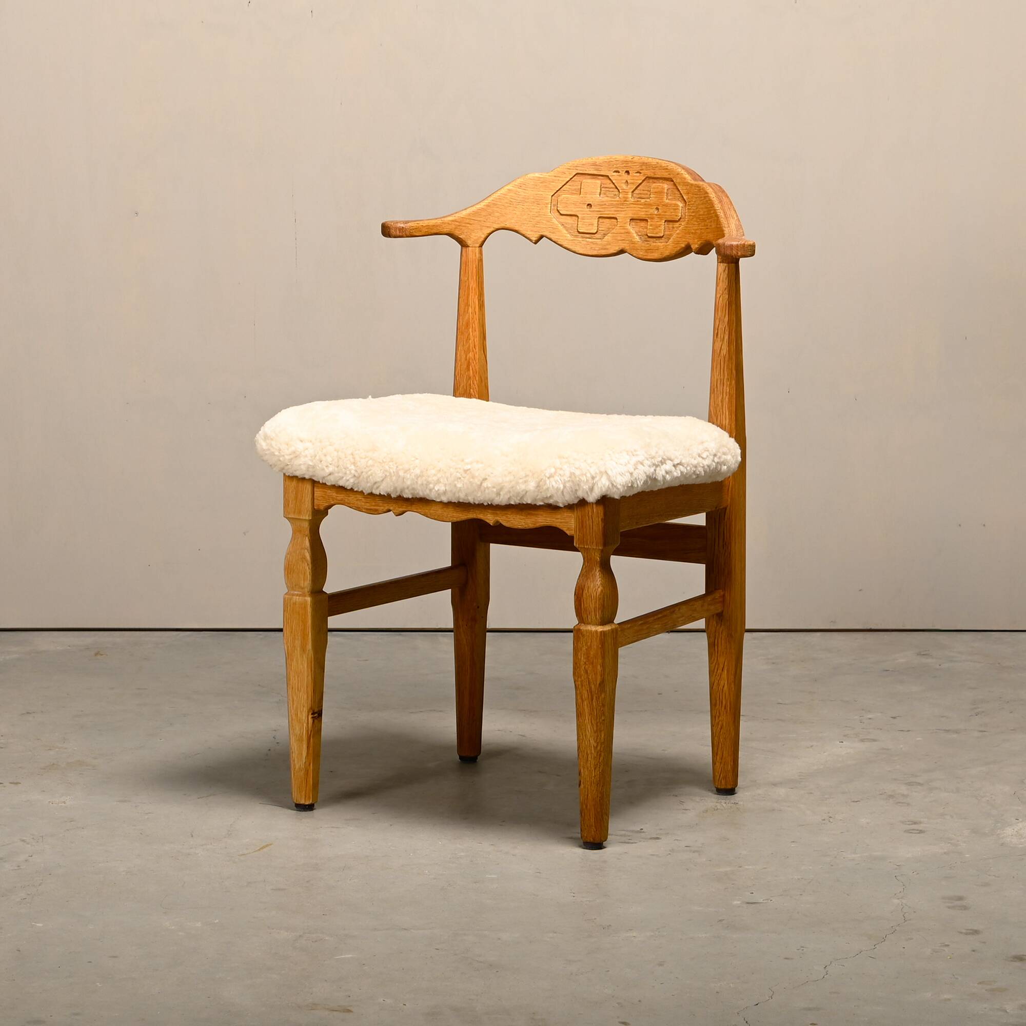 Henning Kjærnulf dining chairs set in Oak and Sheepskin, Denmark, 1960s