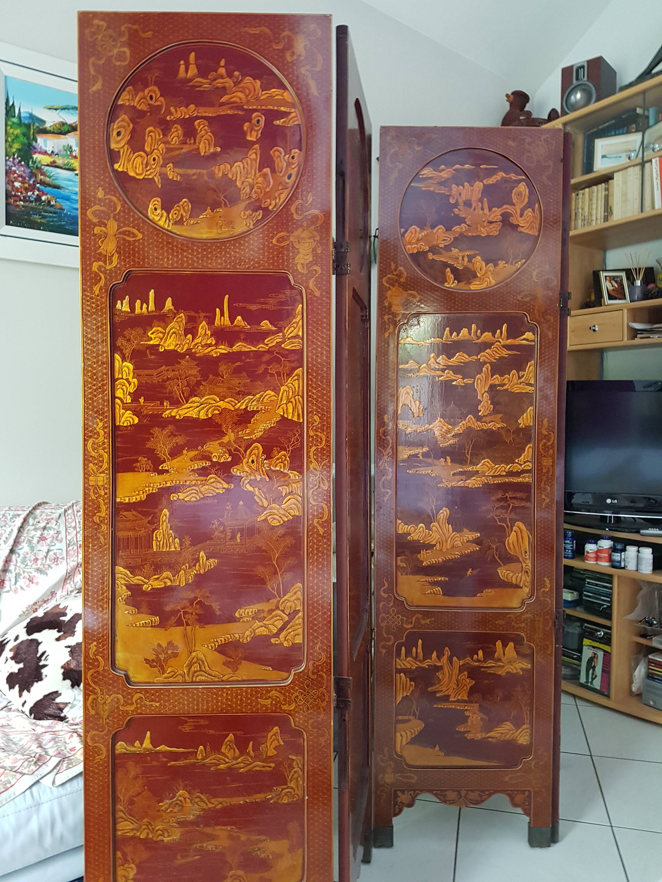Four-panel Japanese-style screen in red and gold lacquer.