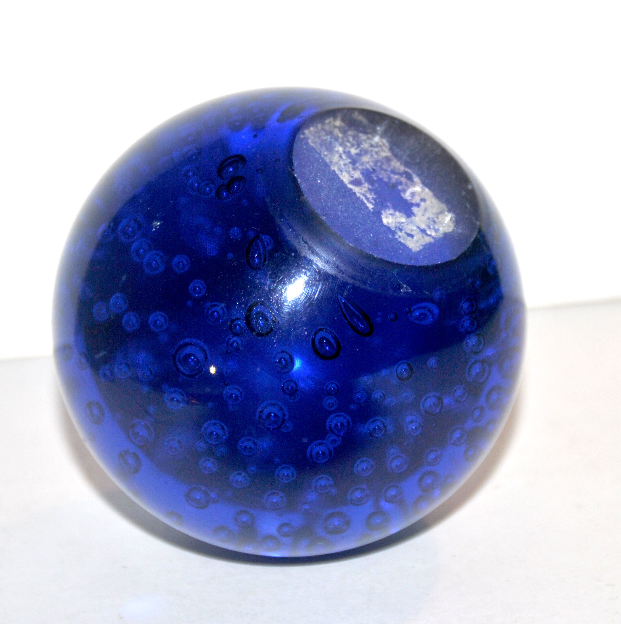 Vintage plastic paper press in cobalt blue