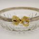 Set of 2 glass and metal bowls with a bow design.
