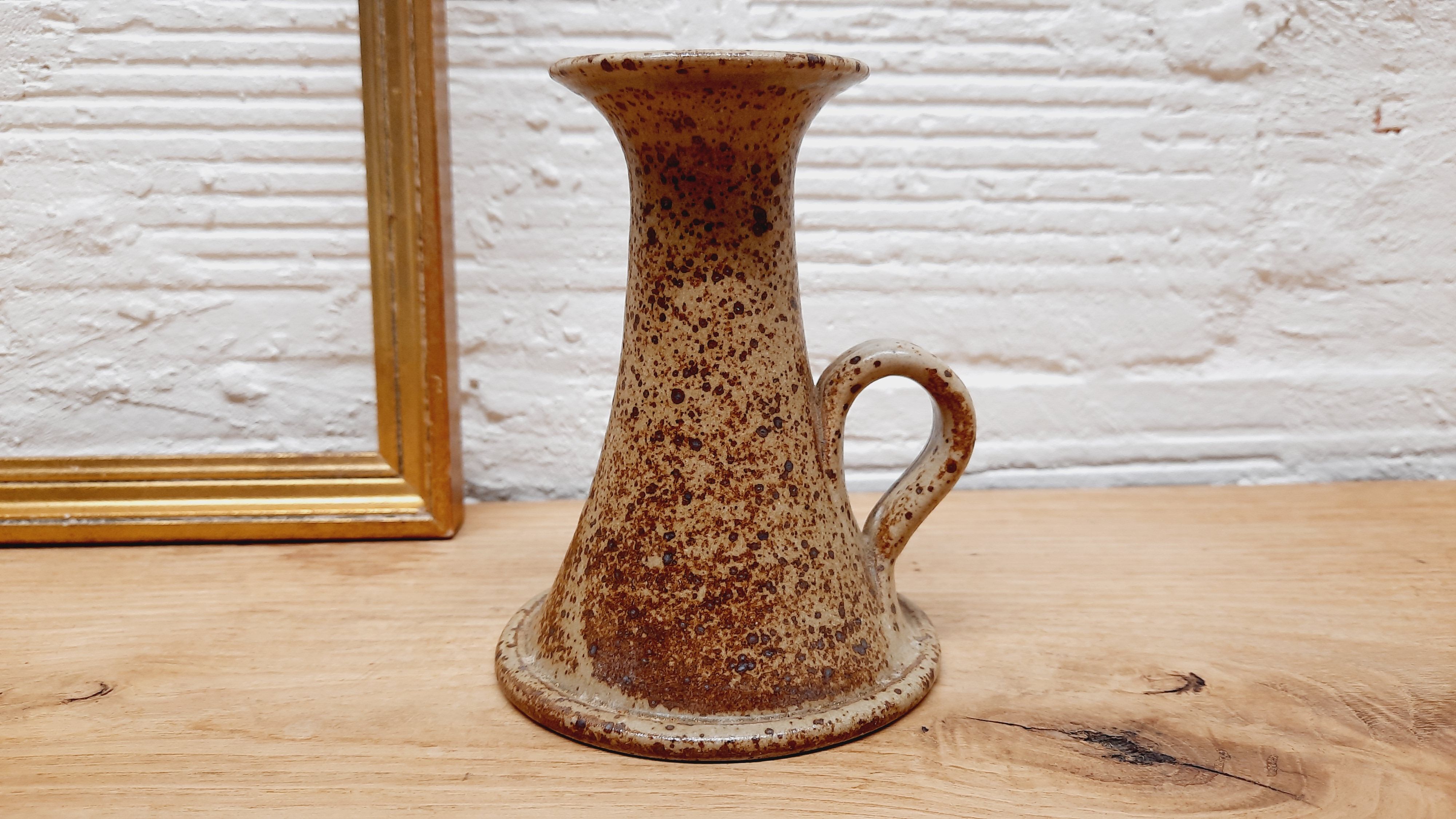 Hand candlestick sandstone
