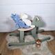 Green and beige wooden rocking horse